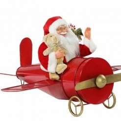 The Christmas Palace Santas 30" MUSICAL ANIMATED SANTA IN CLASSIC PLANE BATTERY OPERATED