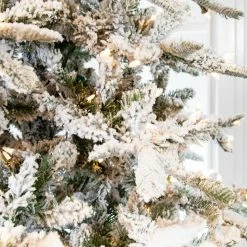 The Christmas Palace 6.5 FT SNOW PINE TREE PRE LIT CLEAR LIGHTS