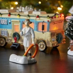 The Christmas Palace SNOW VILLAGE "NATIONAL LAMPOONS" COUSIN EDDIE IN THE MORNING Department 56